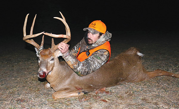 whitetail deer with hunter