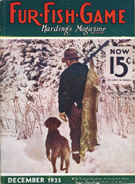 December 1935 hunter with dog and dead bobcat