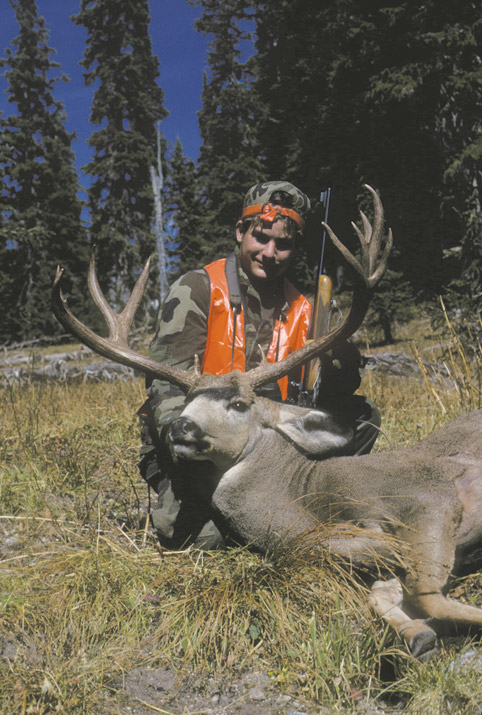 Hunter with Mule Deer