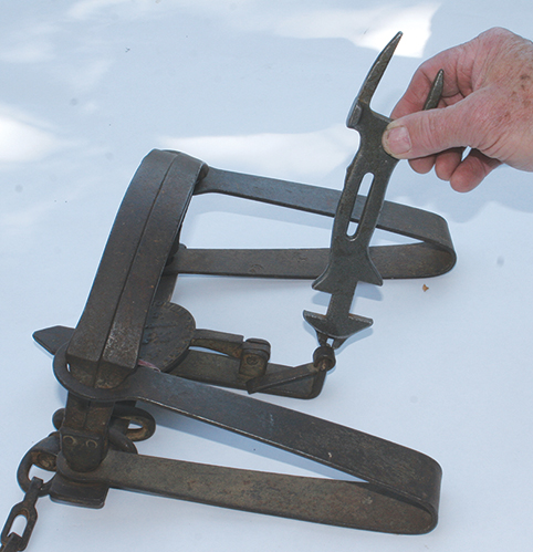 antique oneida trap wrench in use